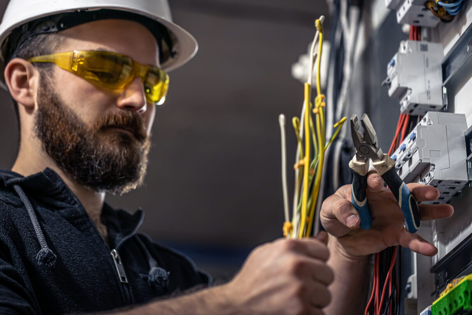 Electrician working at a switchboard